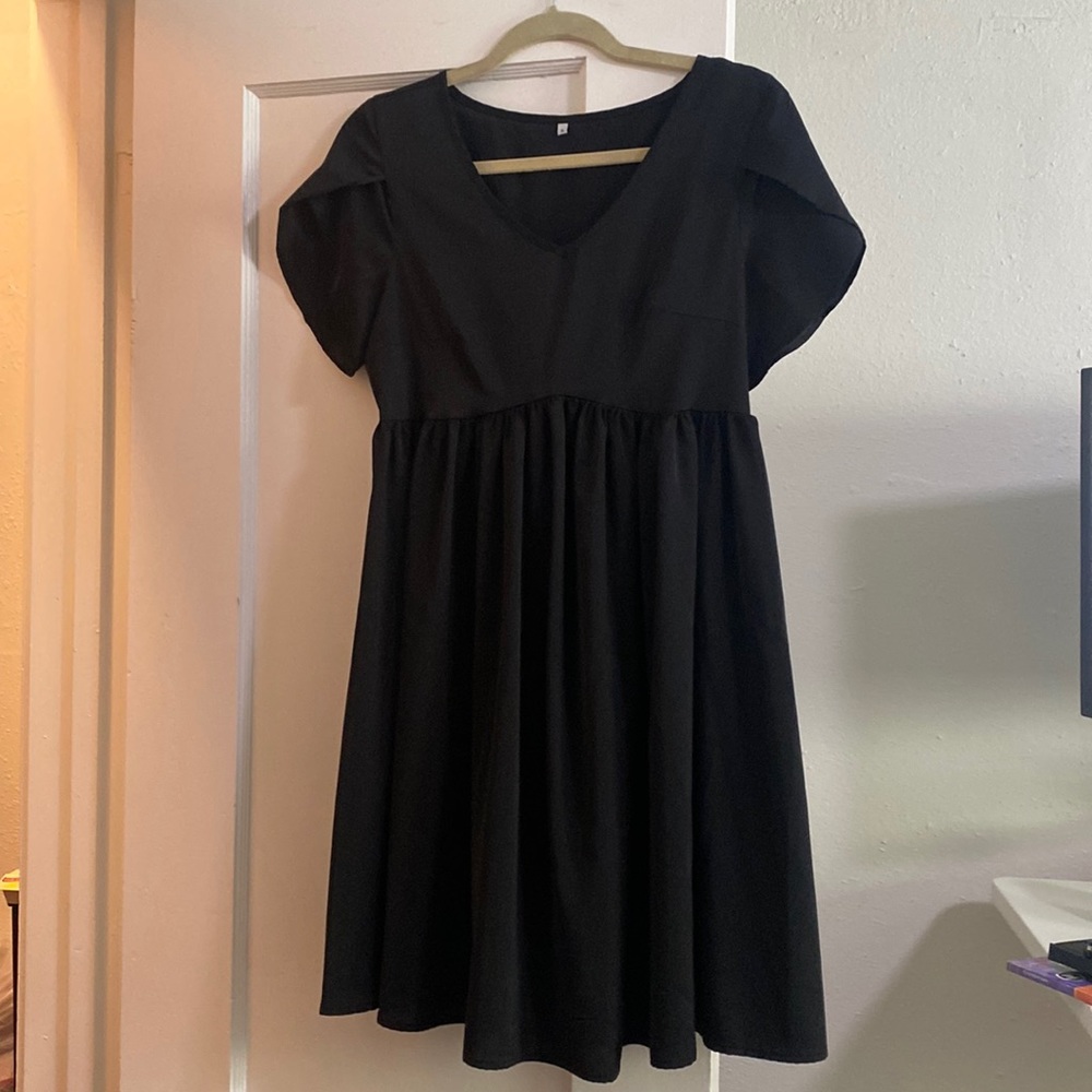 Black baby doll dress tulip sleeves satin type material never worn but no tags